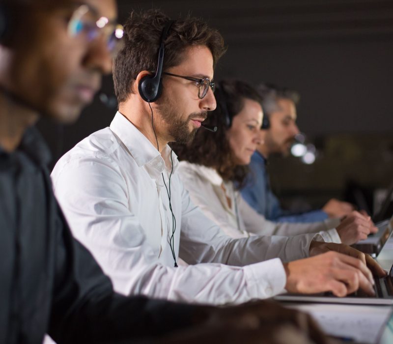 confident-call-center-operator-talking-with-client